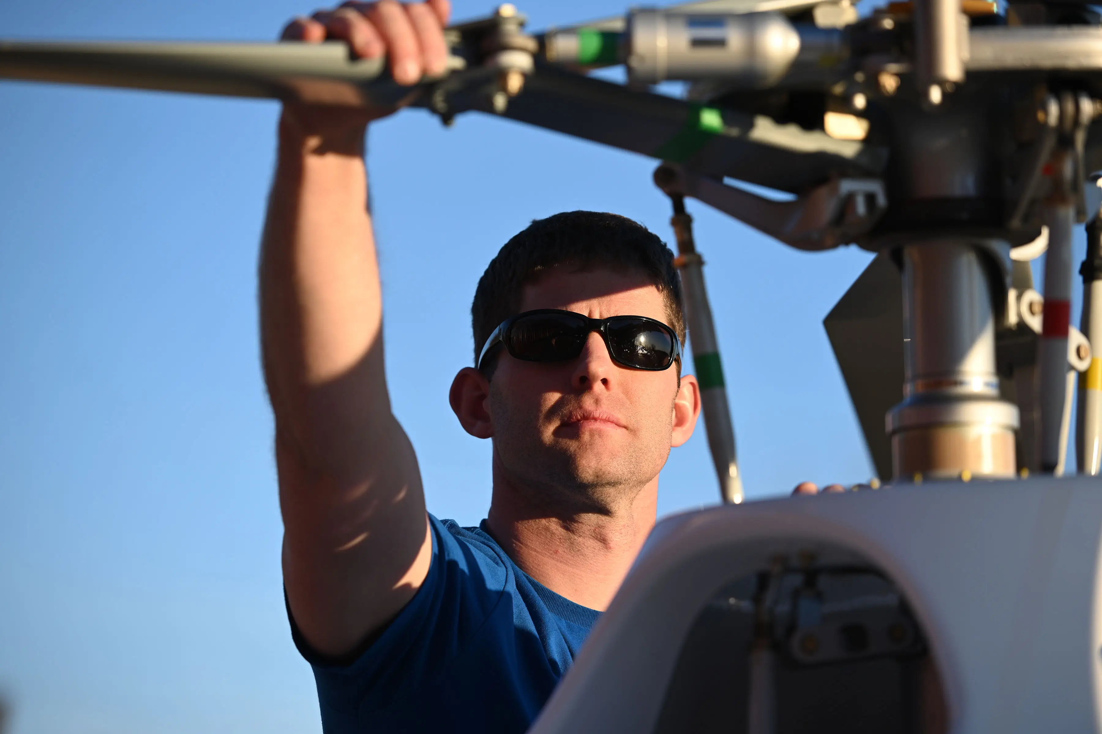 Chief Pilot Todd Guison Checking Helicopter